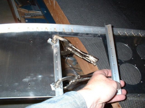 Pre-drilled support angles were used to drill the panel