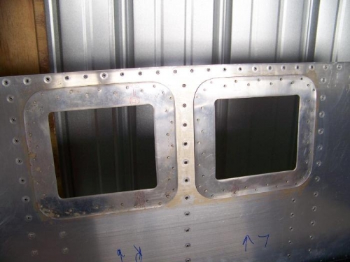Access panel reinforcement rings riveted to top skin - bottom view