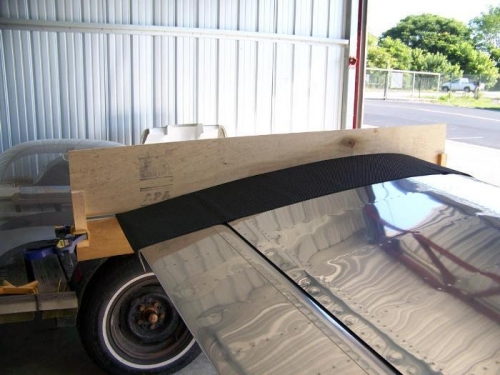Plywood wing profile jig clamped to left wing and aileron