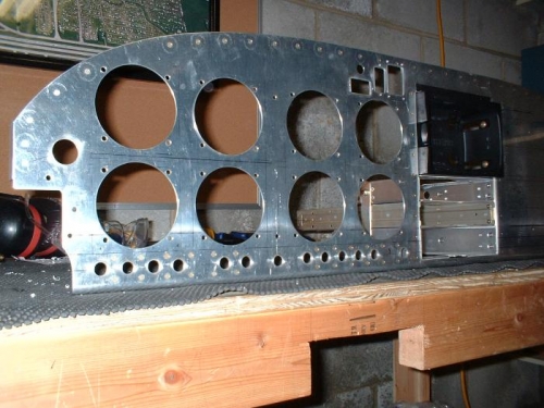 Front view of panel with holes for switches and anti-rotation strips riveted