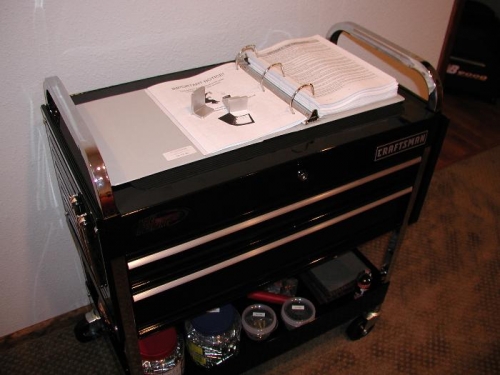 Top lifts up to access storage