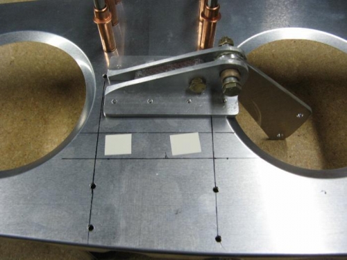 Using double-sided tape to position bellcrank assembly for drilling