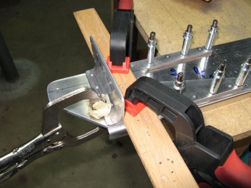 Clampled wood piece to align angle piece for drilling