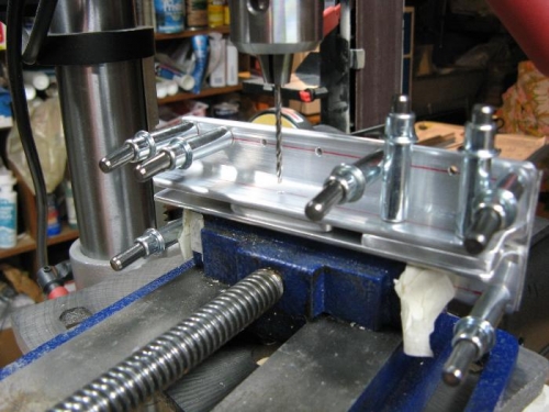 Line drilling the bushing and bolt holes