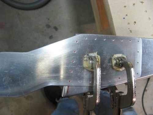 Drilling first plate to rib