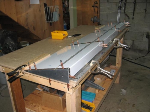 Ribs clecoed into position before drilling hinge pilots