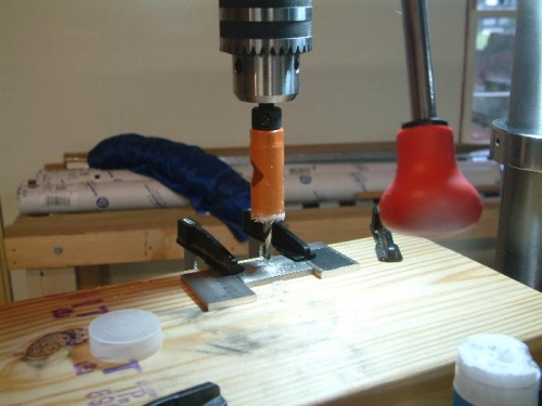 Spacer clamped to table