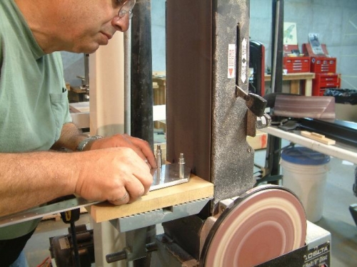 Belt sander makes an easy job of  cutting trough thick aluminum doublers