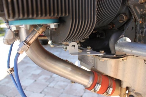 Mixture cable attach bracket on rear of sump.