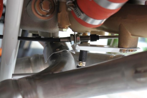 Added heat shield under throttle cable.