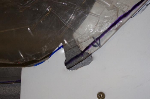 Lightly pound down the forward located skin to let the canopy come out on top of it.