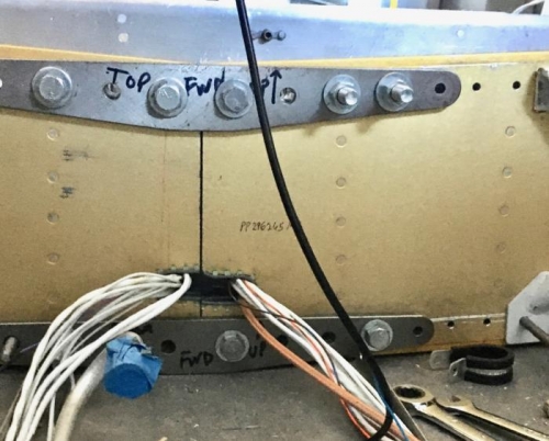 Wiring protectors re-installed after spar was pushed in about one foot.