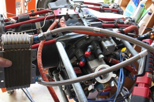 Bottom line brings oil from engine via outlet to right of and below oil filter adapter