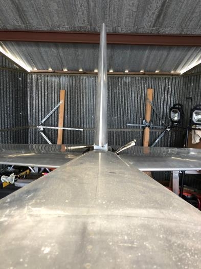 Identical length from top to outer edge of horizontal., On midline.