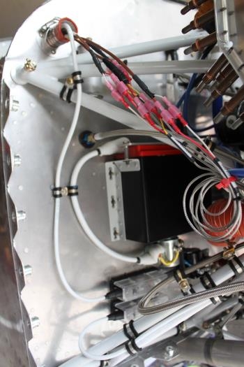 There's the main positive battery cable and the VPX cable secured to firewall and engine mount.