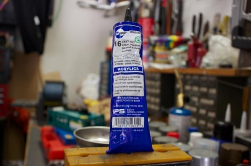 This is clear acrylic cement. Fill stop drilled hole neatly. Use needle to fill. Don't spill over.