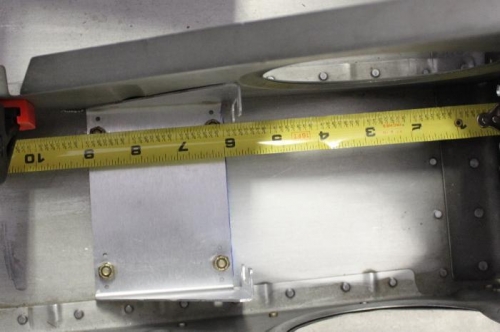 Mounted under co-pilot seat in outer bay