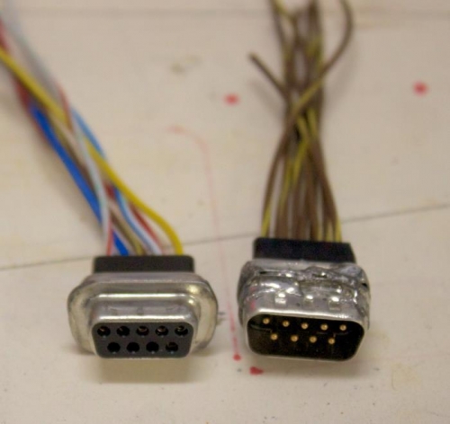 Female DB9 has some of the ears remaining. It fits into base but not in removable stick.