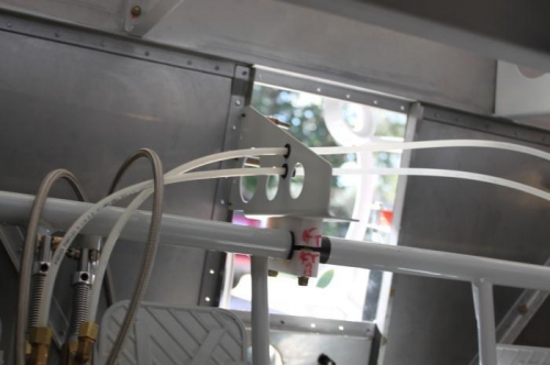 Routing brake tubing between pedals. Need to secure it.