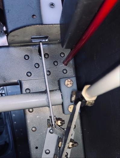 Vans previously approved a 1/4 in hole through the top of the F605 and F604 bulkhead without bushing.