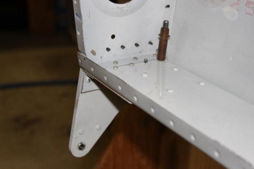 In process of riveting the outboard aileron bracket.