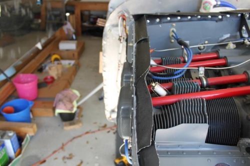 Gray sealant between baffle and rubber seal along the perimeter.