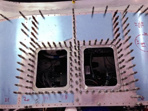 Backing plate on left side butts up to center rib flange. No extra room. 1/2 inch underlay is max.