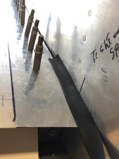 Drilled out 11 #40 rivets, used a strap duplicator to replicate the hole into the wing fairing.