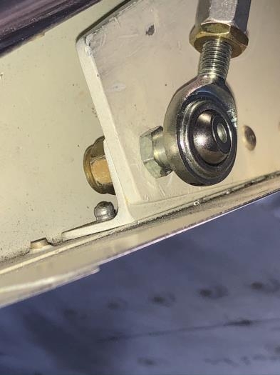 Some people use nutplate here.  This standard locknut works fine and the nut is tricky to start.