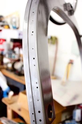 Aluminum rivets go into these holes through matching  countersunk canopy holes.