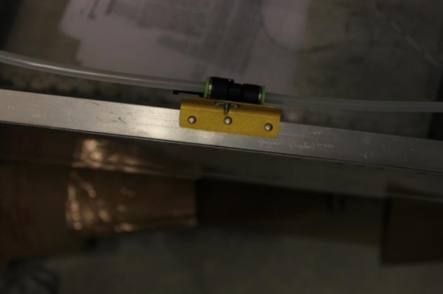 Surplus lightweight angle used.  4-40 nutplate.