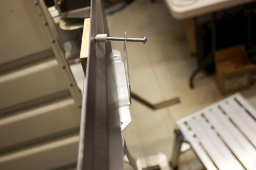 Canopy would be squeezed between machine screw and canopy side rail.