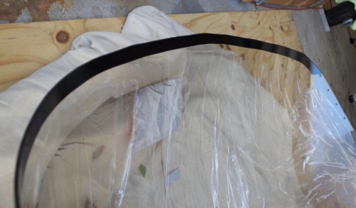 Three coats.  It sets up a clean black line in front of the fiberglass fairing up front.