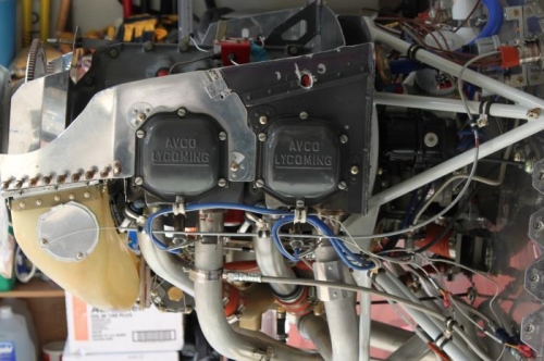 Cable routed past engine and up through firewall passthrough.