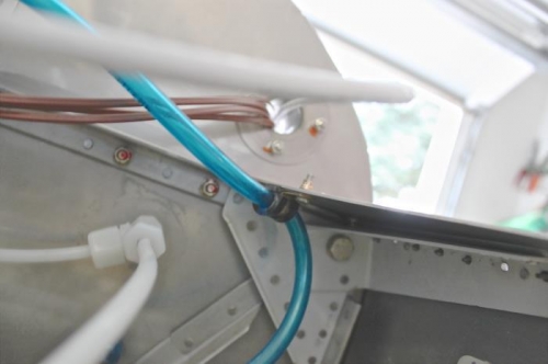 Nutplate for securing manifold pressure tubing.