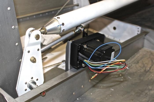 1 washer goes inside the white bracket halves. Used a thin strip as a teetertotter to roll washer in..