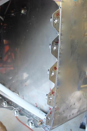 Pilot sidewall and bottom get 8 fasteners for lower cowl.