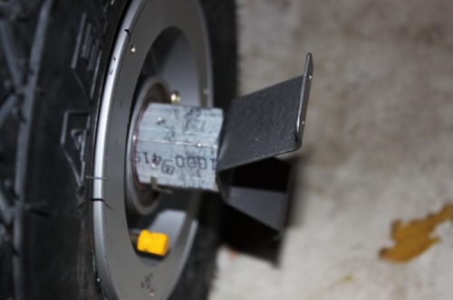 Rule for tightening nut is to tighten until no side play, back off a flat.