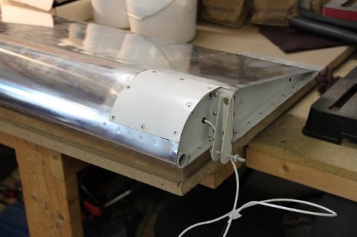 Note the grommet for the wiring to exit the aileron. Cover in place now.