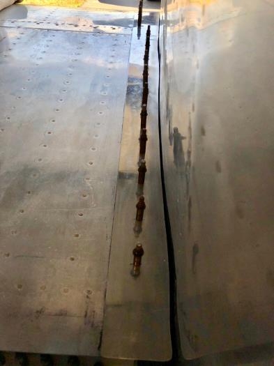 Need to locate and drill the rearmost hole near the flap. Wing-off item to do.