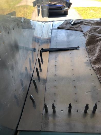 Strap duplicator transfers wing skin hole onto the fairing metal. #40 for starts. Then widen to #30