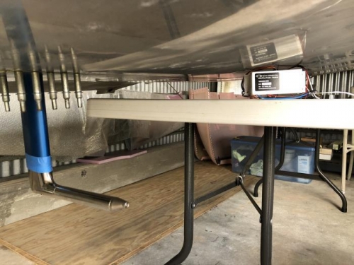 Taped in place and the controller box sits on the table under the wing.