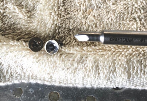 One screw stripped. Drilled center and used EZ out.  See whats left when you try other methods?