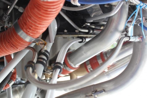 Shares the route with alternator cable and orange SCAT tubing (out of way for now).