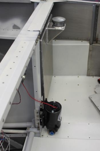 Tank hides nicely out of the way.  Also had to reinstall side panels and floor to mount pump hardware.