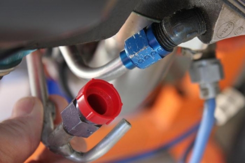 It looks like a hose would have been clamped onto that extended tube to return oil to engine.