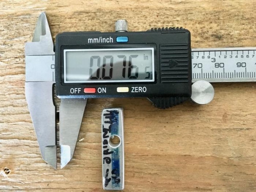 Filed down the one side of spacer to let rear spar go deeper into fuselage per plans.