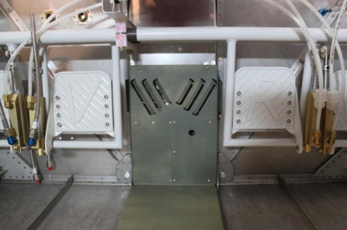 The cover will overlap the pilot longeron and go inside the copilot longeron. RV6 floor is not RV7.