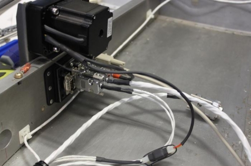 Pitch servo power and disconnect wires installed in Molex connector and tied with waxed lacing chord.