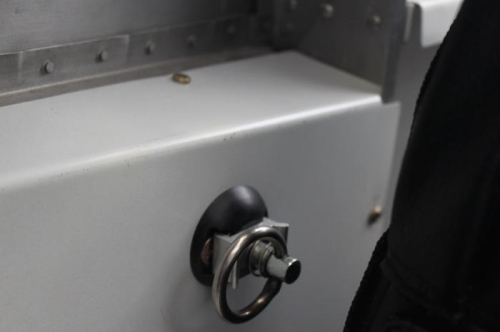 Mounting bolts are safely above the rudder cable travel area on both sides.